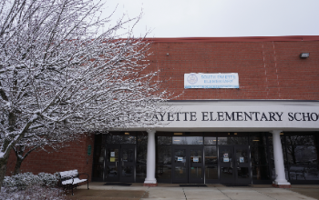 Exterior photo of South Fayette Elementary School with a snow-covered tree