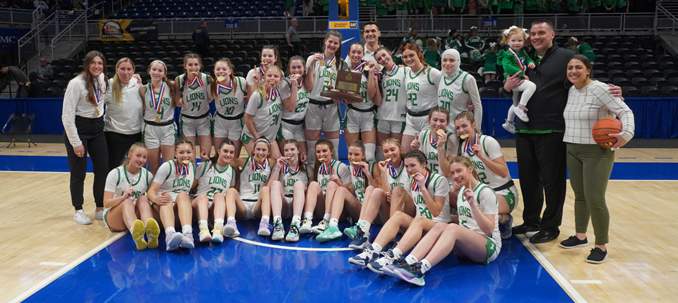 Lady Lions basketball team takes a photo after winning WPIAL Championship